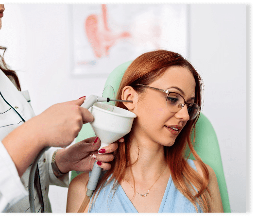 Woman getting at her local hearing clinic to get her ear wax professionally removed